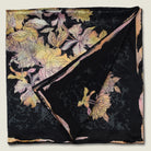 Midnight Rose silk square folded on the diagonal, showing border detail and pattern repeat — Laslett England