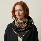 Midnight Rose classic square silk scarf worn loosely tied at the neck, styled with a dark coat — Laslett England