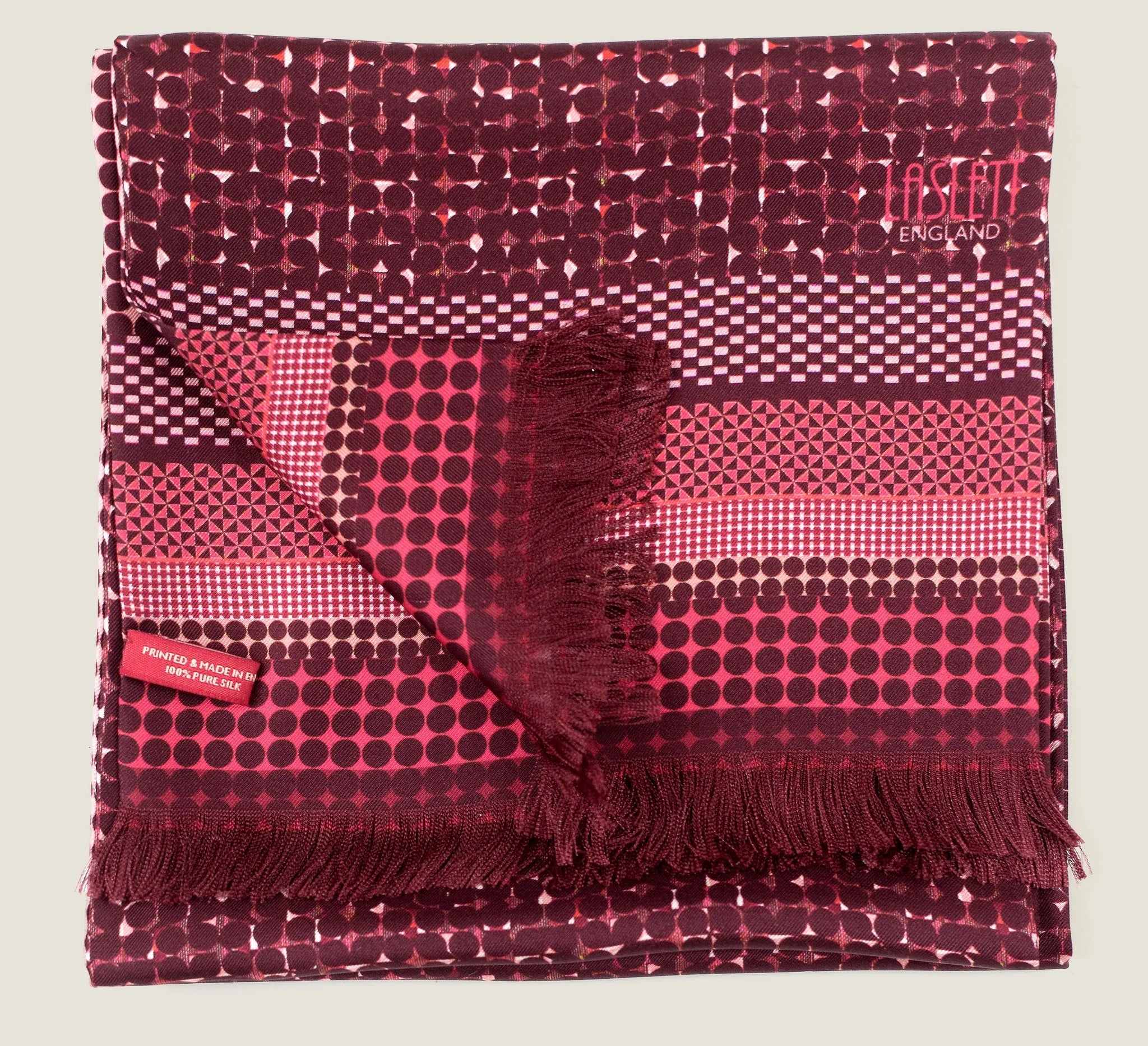 Laslett England Monaco Burgundy Silk Oblong folded flat showing both sides, burgundy dot print alongside pink and burgundy stripe border on 100% silk twill.