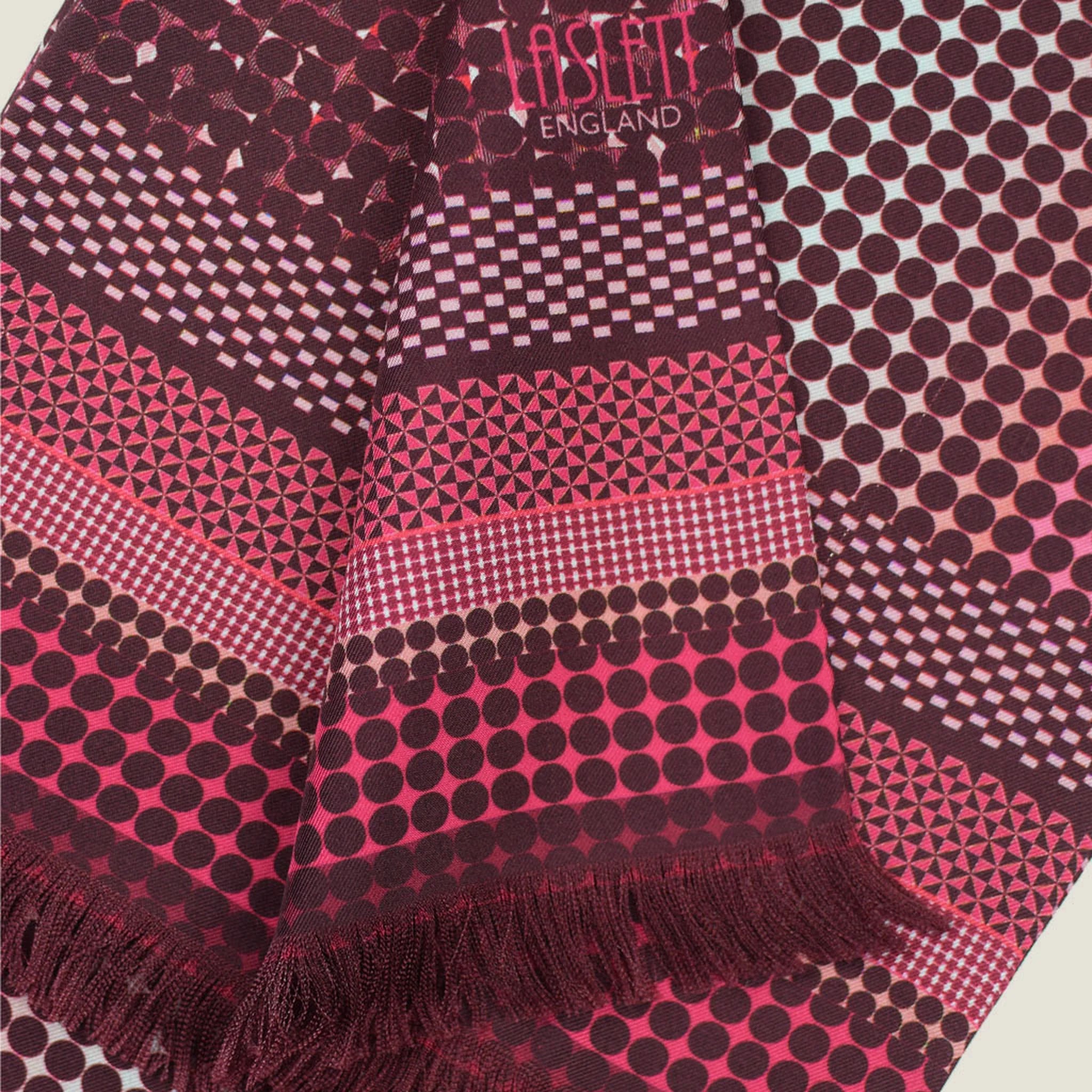 Laslett England Monaco Burgundy Silk Oblong detail showing pink and burgundy stripe border graduating from white dot print on deep burgundy silk twill.