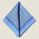 100% silk Moresque Blue Pocket Square in blue by Laslett England. Scarf is shown folded in two into a triangle. 