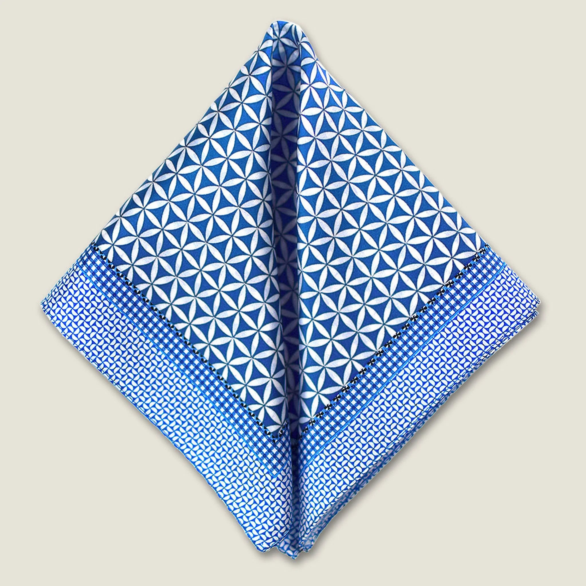 100% silk Moresque Blue Pocket Square in blue by Laslett England. Scarf is shown folded in two into a triangle. 