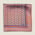 100% silk Moresque Bronze pocket square shown folded into fours in flat lay against a neutral background. 