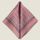 100% silk Moresque Bronze Pocket Square in bronze by Laslett England shown folded into triangles against a neutral background. 