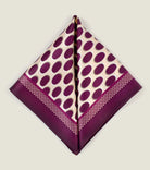 Oval Spot Burgundy pocket square from Laslett England folded into two triangles to show the modern retro pattern. 