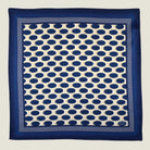 Laslett England Oval Spot Navy pocket square flat lay, cream ground with navy oval spot repeat and navy border