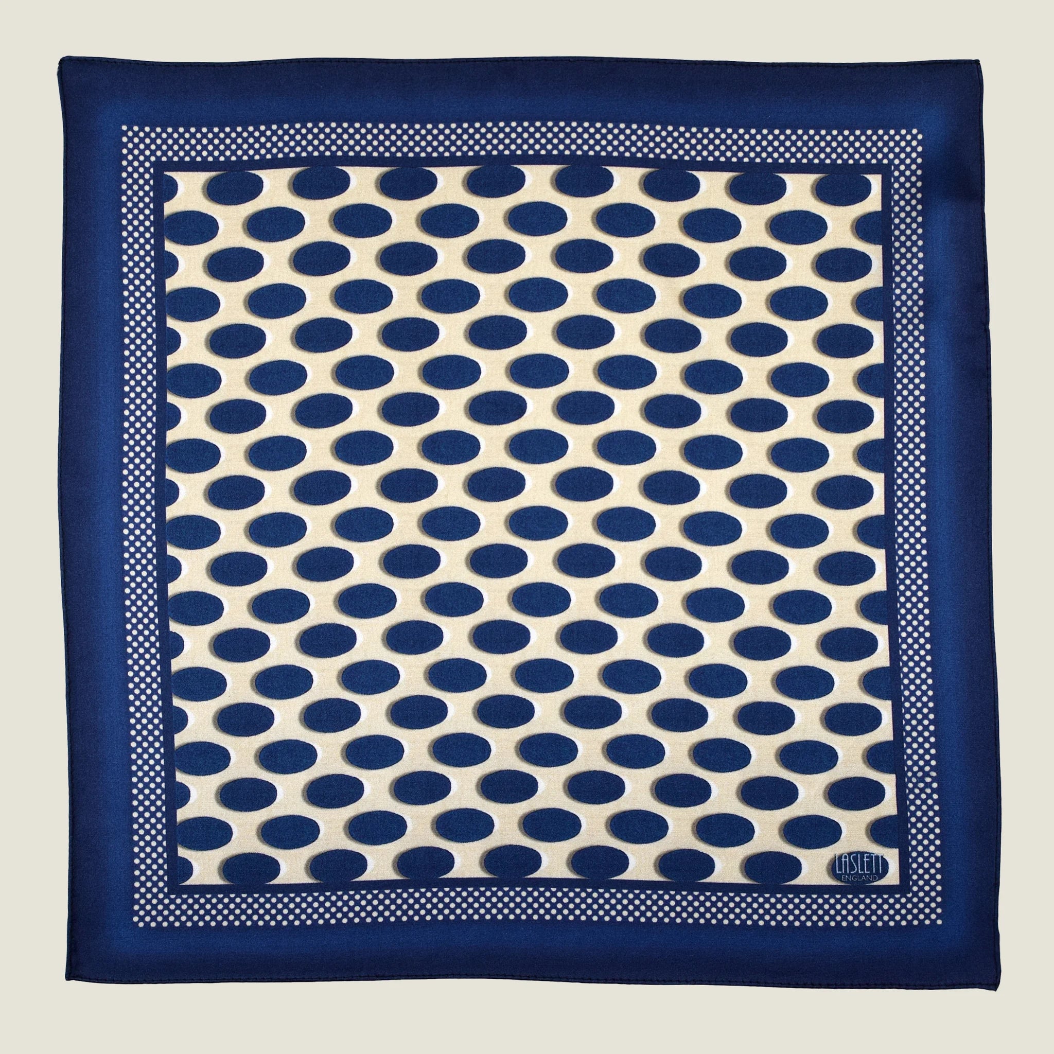 Laslett England Oval Spot Navy pocket square flat lay, cream ground with navy oval spot repeat and navy border