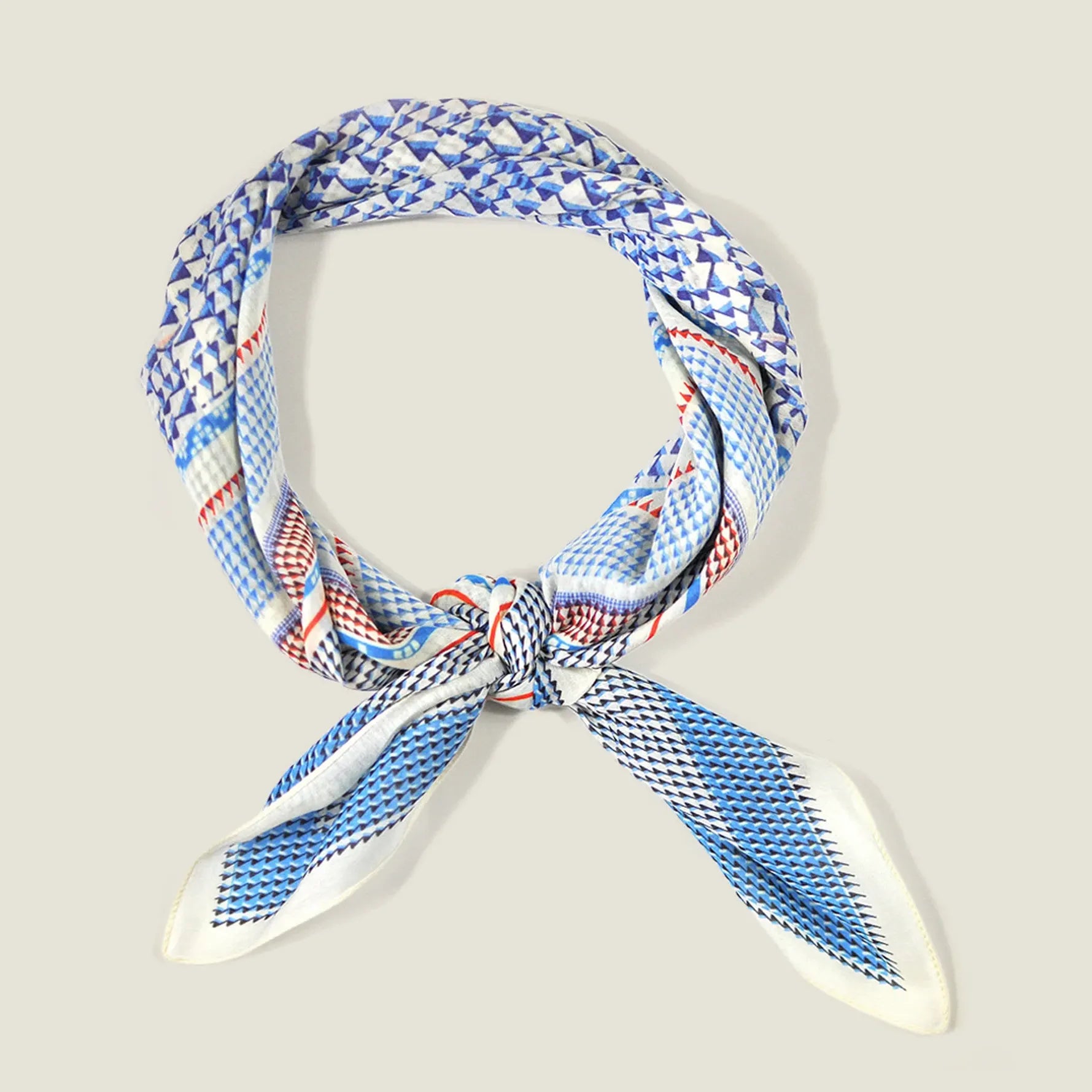 The Laslett England Regatta Silk Scarf tied in a central knot against a neutral background. 