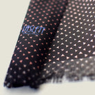 Laslett England Revival Mocha Silk Oblong detail showing mocha brown geometric print and pin-fringed hem on 100% silk twill.
