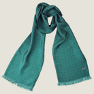 Laslett England Revival Teal Silk Oblong flat lay, 21cm x 165cm double-sided silk twill in teal green with soft pink pin triangle print and pin-fringed hem