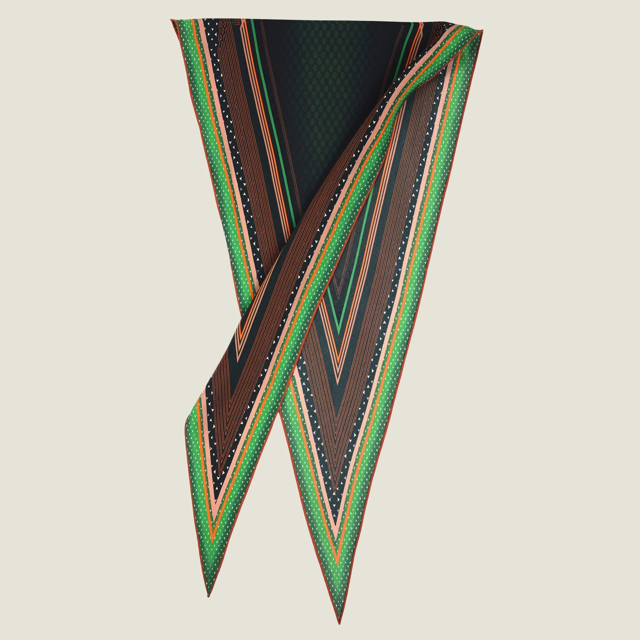100% silk Riviera Emerald Laslett Diamond in orange; green; geometric by Laslett England. Pictured folded in half against a neutral background. 