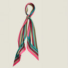 100% silk Seaside Vintage Chiffon Stole in pink and green by Laslett England. Scarf is shown knotted once at the neck. 