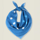 100% silk Solitaire Spot Blue Chiffon in blue by Laslett England. Product shot with scarf tied at back. 