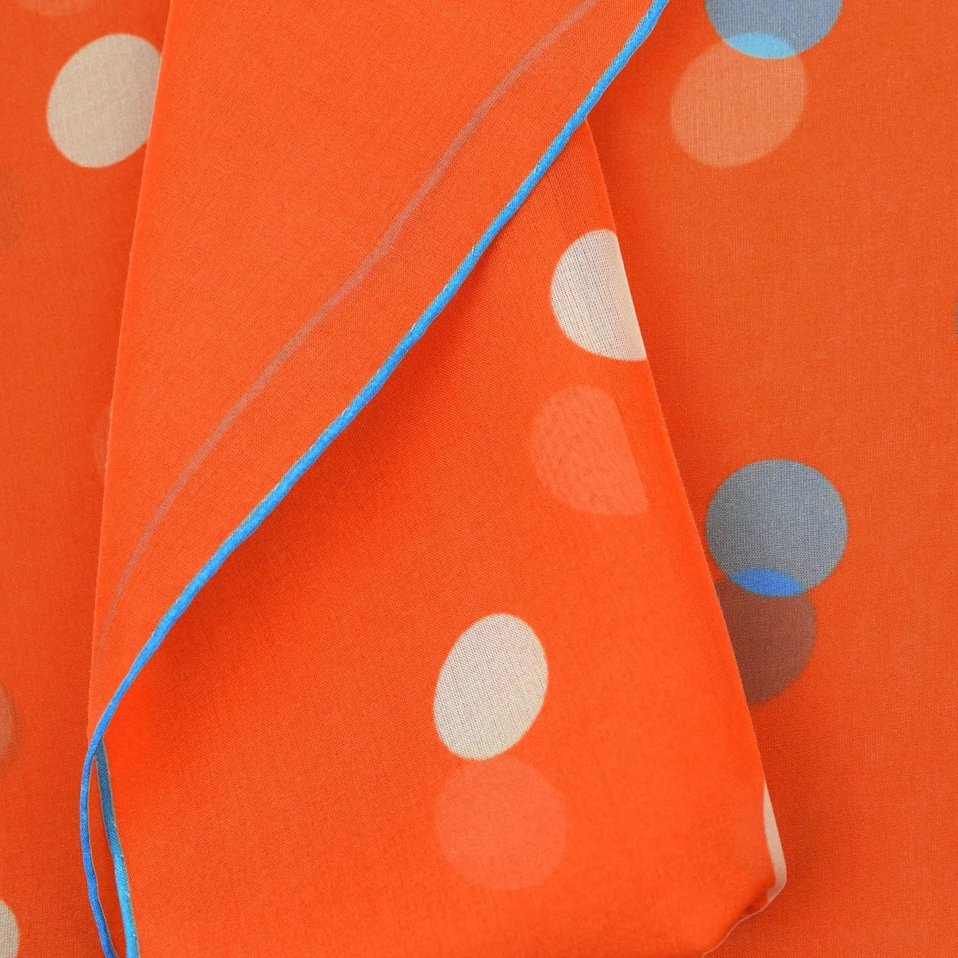 100% silk Solitaire Spot Orange Chiffon in orange by Laslett England. Product shot of scarf tied in front. 