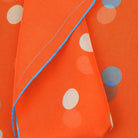100% silk Solitaire Spot Orange Chiffon in orange by Laslett England. Product shot of scarf tied in front. 
