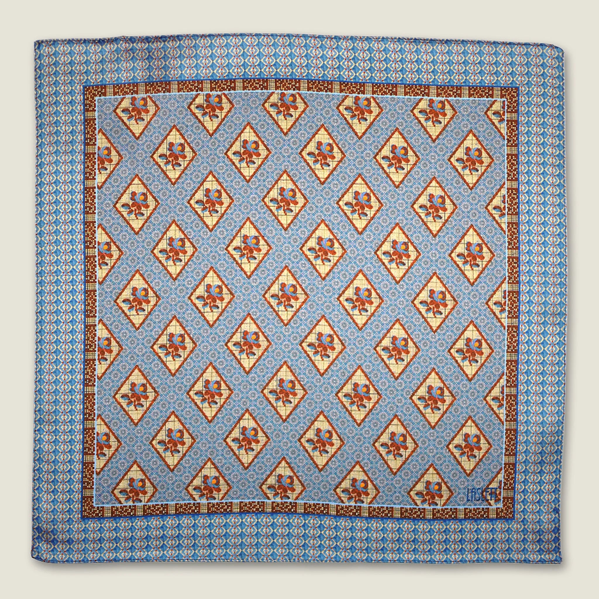 Laslett England Tapestry Rose pocket square folded flat, showing full print repeat in sky blue and terracotta.