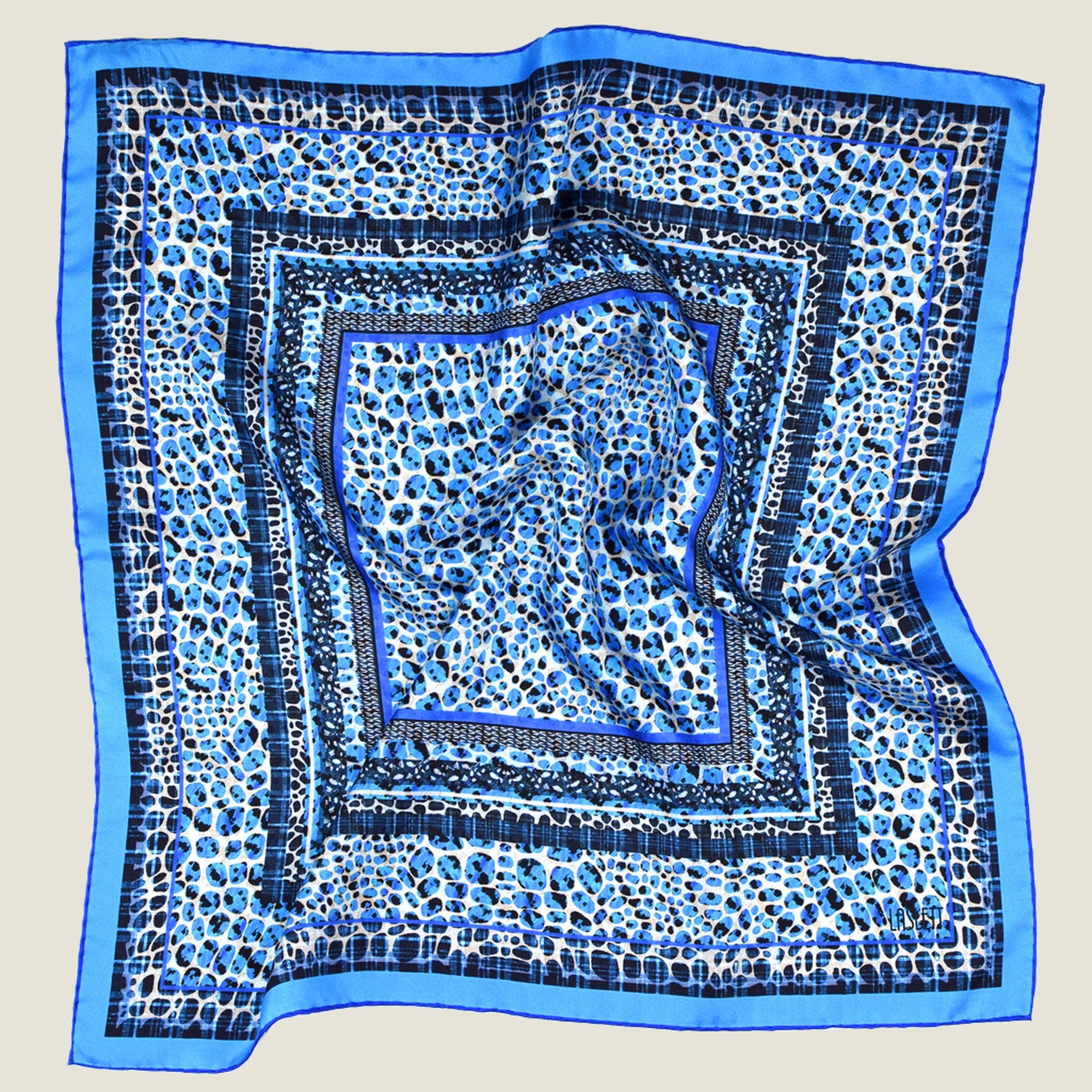 100% silk Tiger Moth Silk Bandana in blue with animal print by Laslett England. Shown in flat lay against a neutral background. 