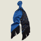 Laslett England Tuxedo Blue Fringed Silk Scarf flat lay showing both sides, cobalt blue with black geometric dot print and black with blue floral sprigs on pinstripe, 10cm black tassel fringe