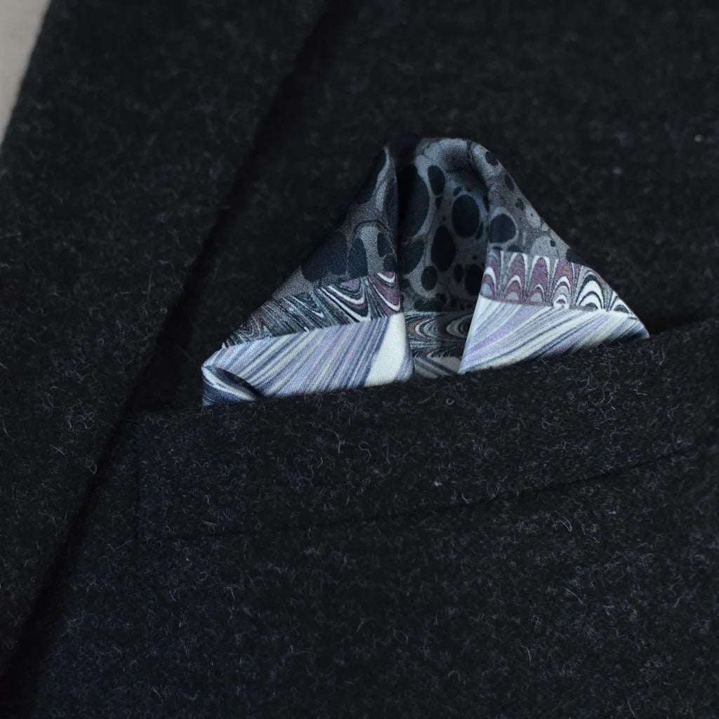 Laslett England Marble Slate pocket square folded into a triangle in a suit pocket. 
