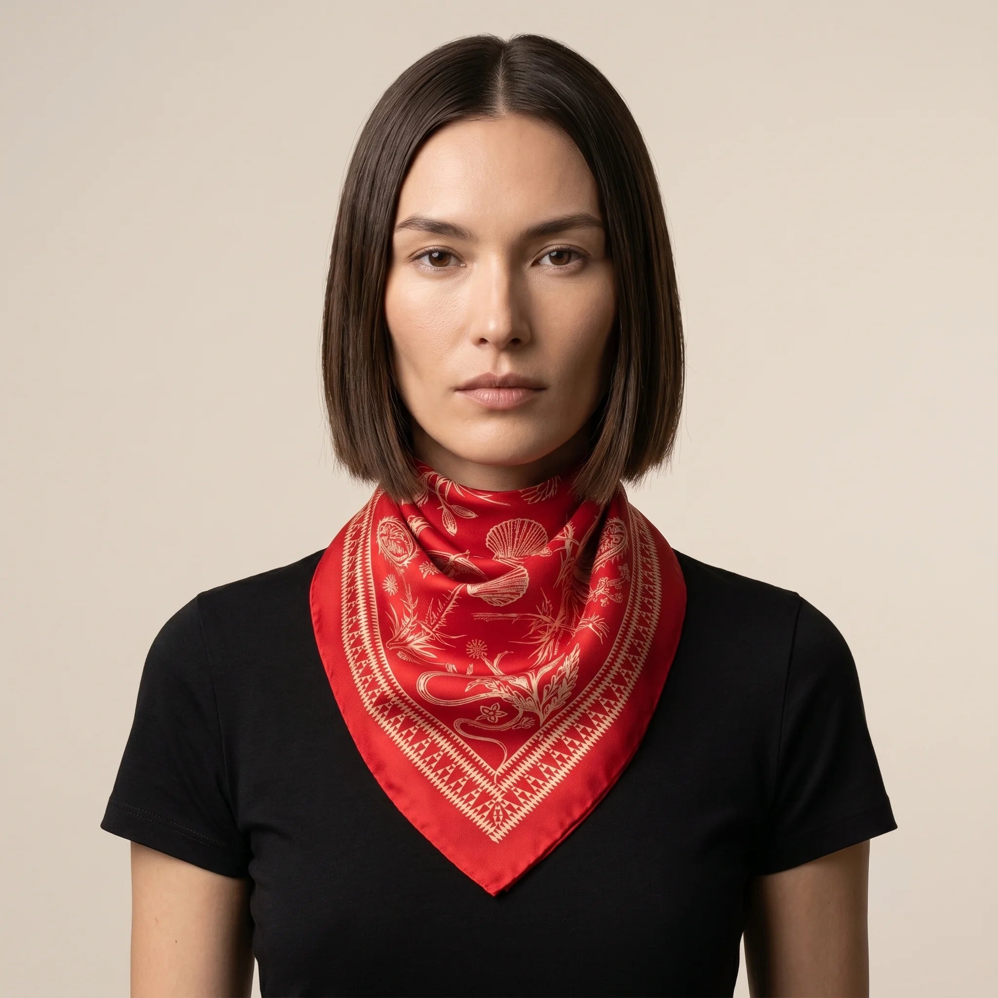 100% silk Marettimo Red Silk Bandana in red by Laslett England. Shown tied neatly around the model's neck. 