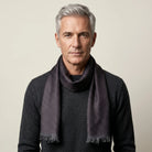 Laslett England Revival Mocha silk oblong shown tied loosely around a male model's neck. 