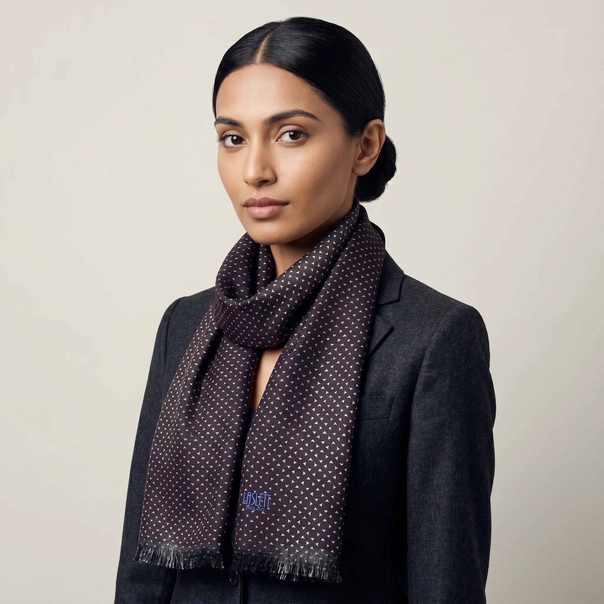 Laslett England Revival Mocha silk oblong shown tied loosely around a female model's neck. 