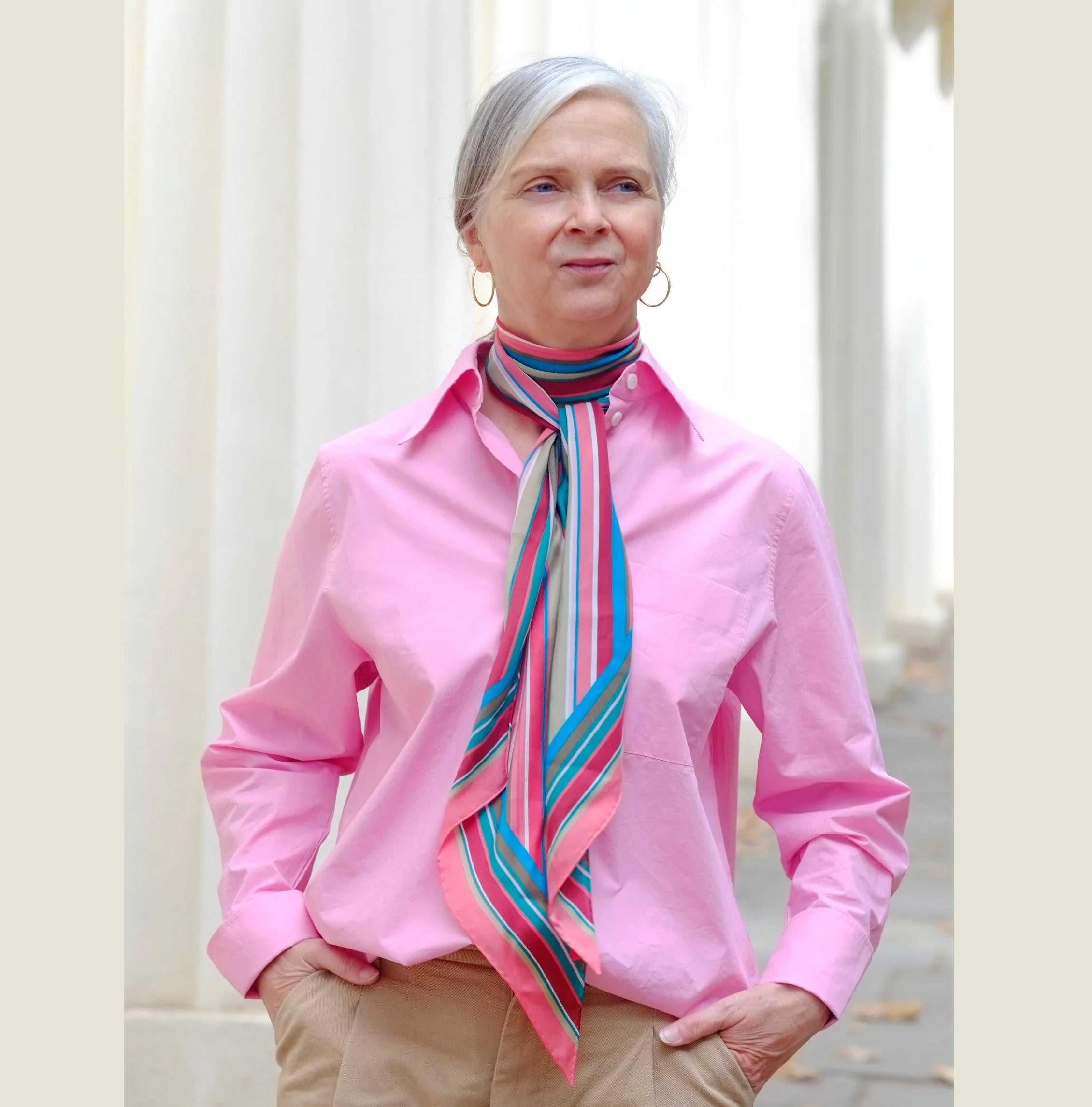 100% silk Seaside Vintage Chiffon Stole in pink and green by Laslett England shown pictured on Alyson Walsh from That's Not my Age wearing a pink shirt. 